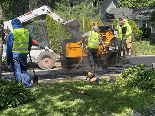 J&J crew paving a driveway