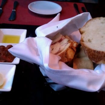 Scarpetta - Bread basket ( stromboli, herb focaccia, roll, sourdough) citrus oil, eggplant caponata, butter - Italian Near Me - Las Vegas, Nevada Scarpetta - Bread basket ( stromboli, herb focaccia, roll, sourdough) citrus oil, eggplant caponata, butter - Italian Near Me - Las Vegas, Nevada