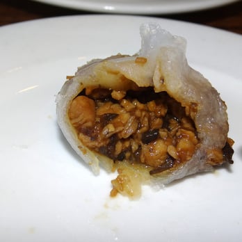 Kon Chau Restaurant - Biting into a pork dumpling.  Yum! - Dim Sum Near Me - Miami, Florida