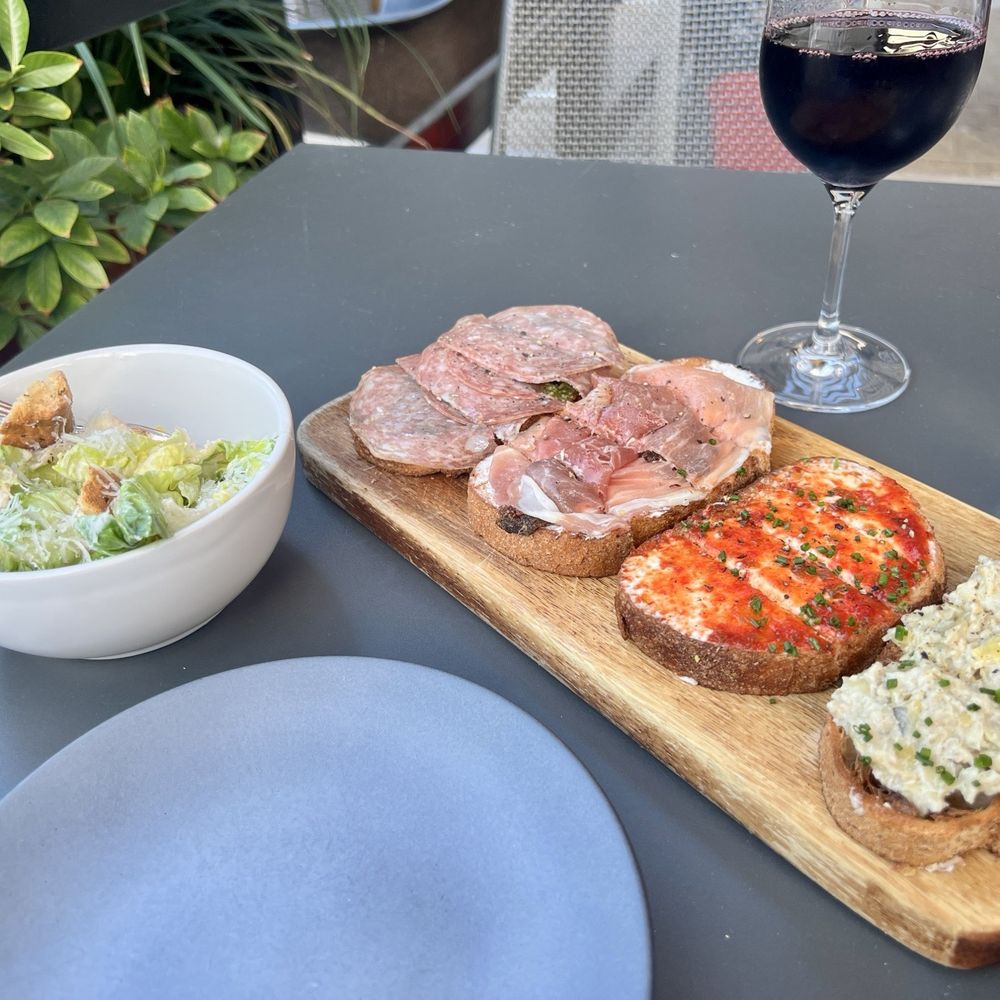 Postino Uptown Park - 1/2 Caesar salad with BRUSCHETTA ( CHOOSE 4 ) : Salami Pesto, Prosciutto and fig, red pepper jam, and artichoke spread - Wine Bars Near Me - Houston, Texas Postino Uptown Park - 1/2 Caesar salad with BRUSCHETTA ( CHOOSE 4 ) : Salami Pesto, Prosciutto and fig, red pepper jam, and artichoke spread - Wine Bars Near Me - Houston, Texas