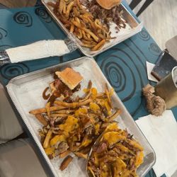 Smurfey's Smokehouse BBQ & Breakfast - Bbq sandwhich and flight with chicken and pork