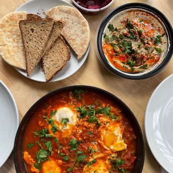 Dizengoff - Take out order: made shakshuka at the bottom to pair with dizengoff hummus (above) - Middle Eastern Near Me - Philadelphia, Pennsylvania