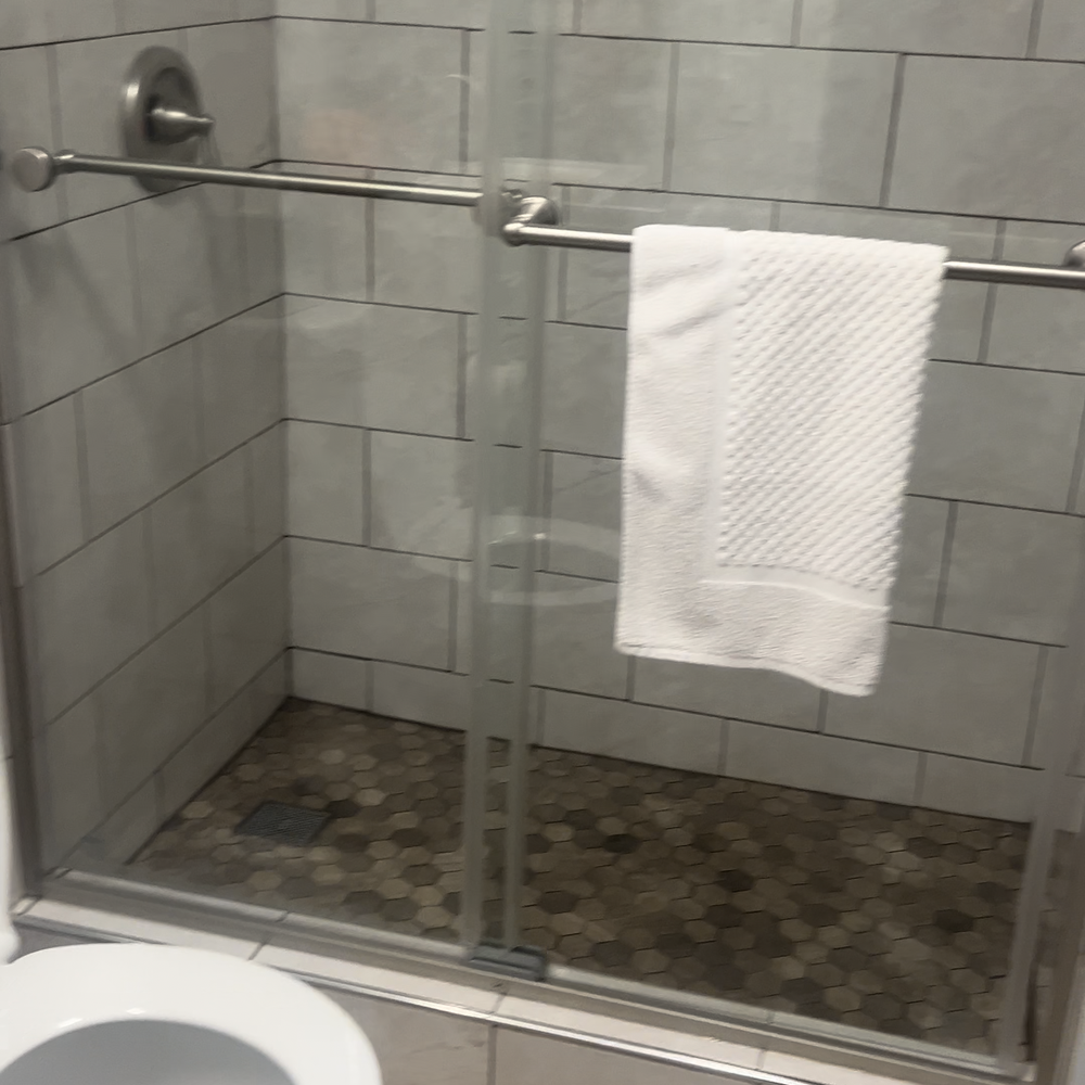 Legacy Lives Construction - a bathroom with a toilet and shower - General Contractors Near Me Legacy Lives Construction - a bathroom with a toilet and shower - General Contractors Near Me