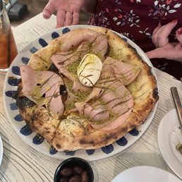 Focaccia Mortadella Pizza Focaccia with mortadella, fresh burrata cheese, and pistachio pesto Focaccia Mortadella Pizza Focaccia with mortadella, fresh burrata cheese, and pistachio pesto