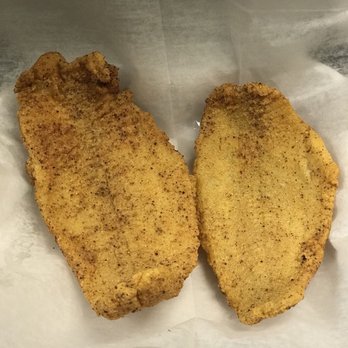 BTJ Wings - two pieces of fried chicken on a piece of wax paper - Chicken Wings Near Me - Anniston, Alabama BTJ Wings - two pieces of fried chicken on a piece of wax paper - Chicken Wings Near Me - Anniston, Alabama
