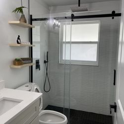 One Family Painting & Remodeling Services - Selving and vanity installed. Bathroom completed