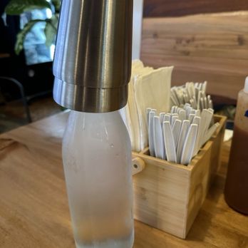 Waimea Butcher Shop - Water is served in a tall bottle with two metal cups. - Butcher Near Me - Waimea, Hawaii