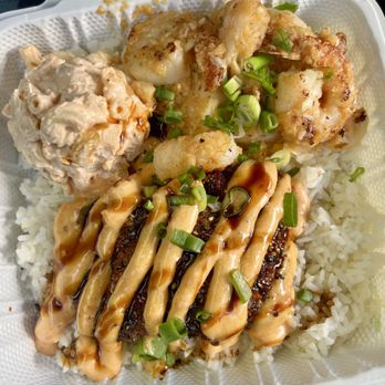Da Bald Guy - Combo plate: peeled garlic shrimp and fried salmon crusted fish topped sauce - $30 - Food Trucks Near Me - Kahuku, Hawaii