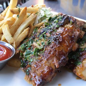 Eureka! - Slow-Roasted Pork Ribs w/ orange chili sauce, chimichurri, confetti coleslaw | $22 - American Near Me - Cupertino, California Eureka! - Slow-Roasted Pork Ribs w/ orange chili sauce, chimichurri, confetti coleslaw | $22 - American Near Me - Cupertino, California