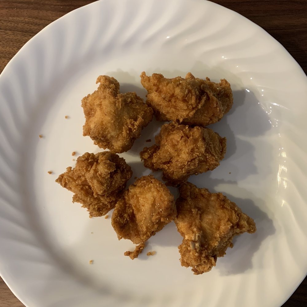 Red Light Chicken - Chicken nuggets on a full size dinner plate for scale. - Chicken Shop Near Me - Chicago, Illinois Red Light Chicken - Chicken nuggets on a full size dinner plate for scale. - Chicken Shop Near Me - Chicago, Illinois