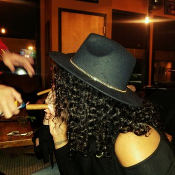 Blaze Cigar Lounge and Bar - a woman smoking a cigar - Cigar Bars Near Me - Newport, Kentucky Blaze Cigar Lounge and Bar - a woman smoking a cigar - Cigar Bars Near Me - Newport, Kentucky