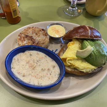 Snooze, an A.M. Eatery - Sandwich I Am + avocado Side of gravy (10/10 recommend pairing with the sandwich) Side of hash browns - Breakfast & Brunch Near Me - Nashville, Tennessee
