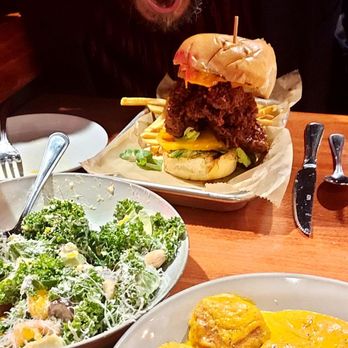 Hemlock House - Husband mugs with his Dante's Beak Nashville Hot Chicken thigh sandwich, kale salad we shared, and my pumpkin gnudi - Tapas/Small Plates Near Me - Swissvale, Pennsylvania