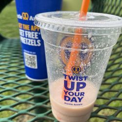 Cinnamon, sugar, pretzel in a cup and a strawberry smoothie