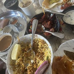 Crispy Chilli Chicken, some Vijayawada Lamb Biryani and an assortment of napkins, tea, and lactose supplements for my weak GI tract