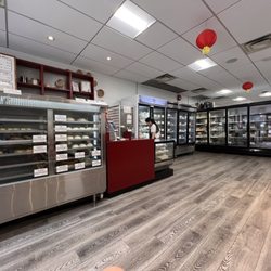Kam Wai Dim Sum - View of the hot items you can eat there on the left, the freezers on the right.