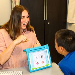 A speech-language session in action, using interactive technology to build communication skills.