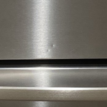 Delerio Construction - dented fridge on the front - General Contractors Near Me - Fresno, California