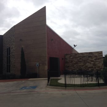 Dos Chiles Grandes - a large building with a fence and gate - Mexican Near Me - Bridgeport, Texas
