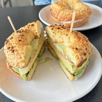 Tandem Bagel Company - savory breakfast sandwich on a cheesy garlic bagel + asiago bagel with olive cream cheese - Coffee & Tea Near Me - Florence, Massachusetts Tandem Bagel Company - savory breakfast sandwich on a cheesy garlic bagel + asiago bagel with olive cream cheese - Coffee & Tea Near Me - Florence, Massachusetts