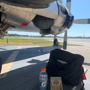 Epic Flight Academy - Quick lunch under the DC-7 courtesy of Epics snack bar. - Flight Instruction Near Me - New Smyrna Beach, Florida Epic Flight Academy - Quick lunch under the DC-7 courtesy of Epics snack bar. - Flight Instruction Near Me - New Smyrna Beach, Florida