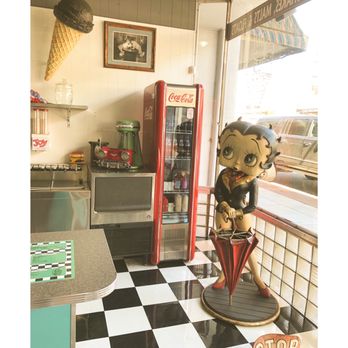 Dutch Mill Diner - a statue of a woman sitting on a stool - Diners Near Me - Tillamook, Oregon Dutch Mill Diner - a statue of a woman sitting on a stool - Diners Near Me - Tillamook, Oregon