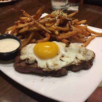 Amsterdam Cafe - Steak with an egg on top and frites - New American Near Me - Auburn, Alabama
