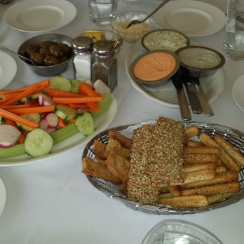 Berta's Chateau - Table setting of bread breadsticks veggies flatbread cheddar blue cheese and horseradish spreads. - Italian Near Me - Wanaque, New Jersey