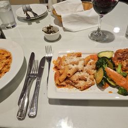 Vincitore Italian Restaurant - Salmon pasta and veal parmesan.