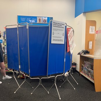 CVS Pharmacy - a man standing in front of a blue screen - Drugstores Near Me - Yonkers, New York