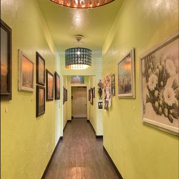 The Local - Hallway that leads to both bathrooms on each end with For Sale art displayed - American Near Me - Prescott, Arizona The Local - Hallway that leads to both bathrooms on each end with For Sale art displayed - American Near Me - Prescott, Arizona