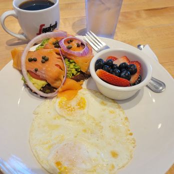 Eggsquisite Cafe - Rockwall - SALMON Avocado Toast, 2 eggs, option of Berries, or Melon slices. - Breakfast & Brunch Near Me - Rockwall, Texas