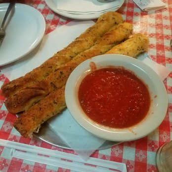 Gianni's Pizza - Bread sticks and marinara sauce - Italian Near Me - Monterey, California Gianni's Pizza - Bread sticks and marinara sauce - Italian Near Me - Monterey, California
