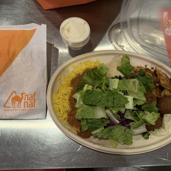Naf Naf Grill - Build-your-own-plate - $12.95 for chicken shawarma, falafel, hummus, basmati rice, pita bread, and toppings.  Decent. - Middle Eastern Near Me - Rosemont, Illinois