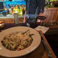 Sebastian's Fine Food & Spirits - The scratch duck pasta with a nice glass of wine.