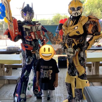 Character Masters - Optimus Prime, Bumble Bee, and birthday boy in the middle. - Party Characters Near Me