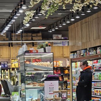 Gastro Market - a man standing in front of a counter - Grocery Near Me - New York, New York Gastro Market - a man standing in front of a counter - Grocery Near Me - New York, New York