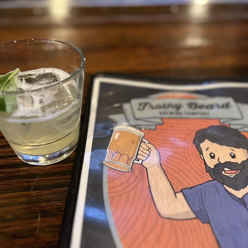 Frothy Beard Off World - a man holding a glass of beer - Breweries Near Me - Summerville, South Carolina Frothy Beard Off World - a man holding a glass of beer - Breweries Near Me - Summerville, South Carolina