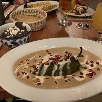 Doña - Chilli relleno with fine tasting sauce and pomegranate. Finger licking good. - Mexican Near Me - Oakland, California Doña - Chilli relleno with fine tasting sauce and pomegranate. Finger licking good. - Mexican Near Me - Oakland, California