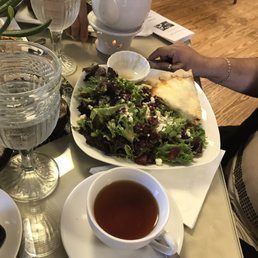 a plate of food and a cup of tea a plate of food and a cup of tea