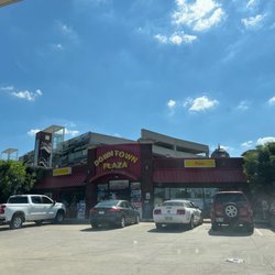Downtown Plaza Convenience Store - Front (in the light of day).