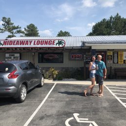 a man and a woman standing in a parking lot a man and a woman standing in a parking lot