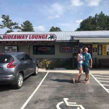 Hideaway Lounge - a man and a woman standing in a parking lot - Lounges Near Me - Jacksonville, North Carolina Hideaway Lounge - a man and a woman standing in a parking lot - Lounges Near Me - Jacksonville, North Carolina