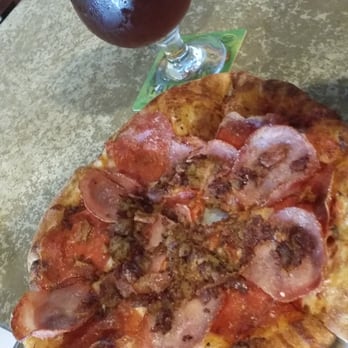 Pinthouse Pizza - This is the cannonball pizza paired with the Steven's Point Whole Hog Pumpkin ale. Both were delicious! - Pizza Near Me - Austin, Texas