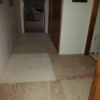 J.V's Floorcoverings - hallway with fresh plywood,  Was glued AND screwed down so no more squeaky floors! - Carpet Installation Near Me