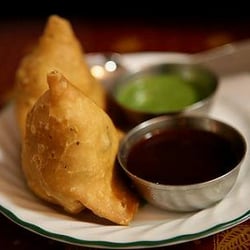 Aman's Kitchen - Samosa - crispy pastry filled with spicy potato and peas, served with chutneys (sauces)