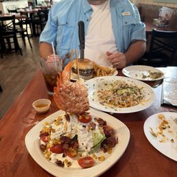 Wedge salad with shrimp, crab nachos, bacon and blue burger Wedge salad with shrimp, crab nachos, bacon and blue burger