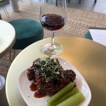 A Concrete Rose Bookbar - Chicken wings with concord bbq sauce and a glass of Concord Jungle - Wineries Near Me - Lancaster, Pennsylvania A Concrete Rose Bookbar - Chicken wings with concord bbq sauce and a glass of Concord Jungle - Wineries Near Me - Lancaster, Pennsylvania