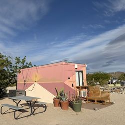 Joshua Tree Lake Rv & Campground - Cabin comes with a table and seating area in front. Heater inside and lighting