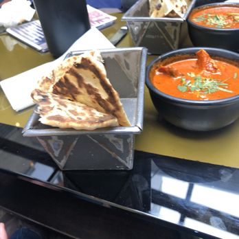 Dishoom - Chicken ruby and garlic naan (front) and cheese naan (back) - Indian Near Me - London, XGL